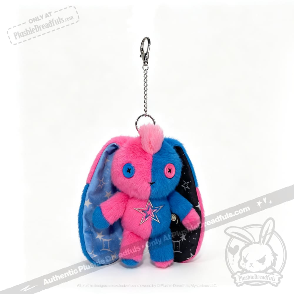 Gemini Rabbit plushie keychain with pink and blue body, star patch, and button eyes—Plushie Dreadfuls exclusive.