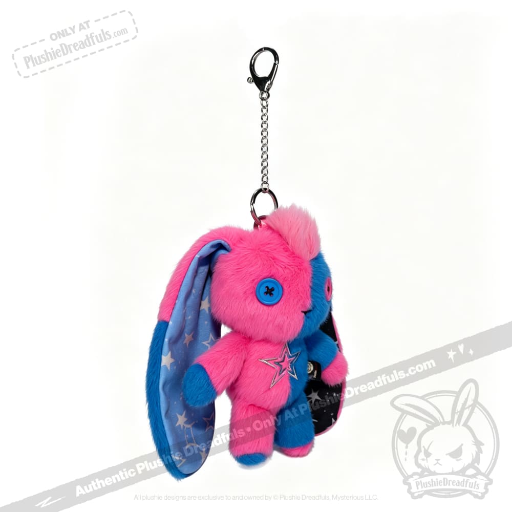 Plushie Dreadfuls Gemini Rabbit keychain with pink and blue fur, star details, and a clasp chain on white background.