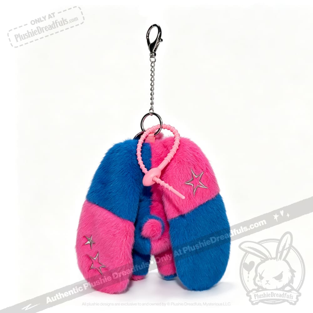 Gemini Rabbit plush keychain with blue and pink sections, star embroidery, long ears, and a pink cord attached.