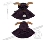 Purple hooded cape plushie by Plushie Dreadfuls with ram horns, layered design, and skull charm; 28cm/11” tall.