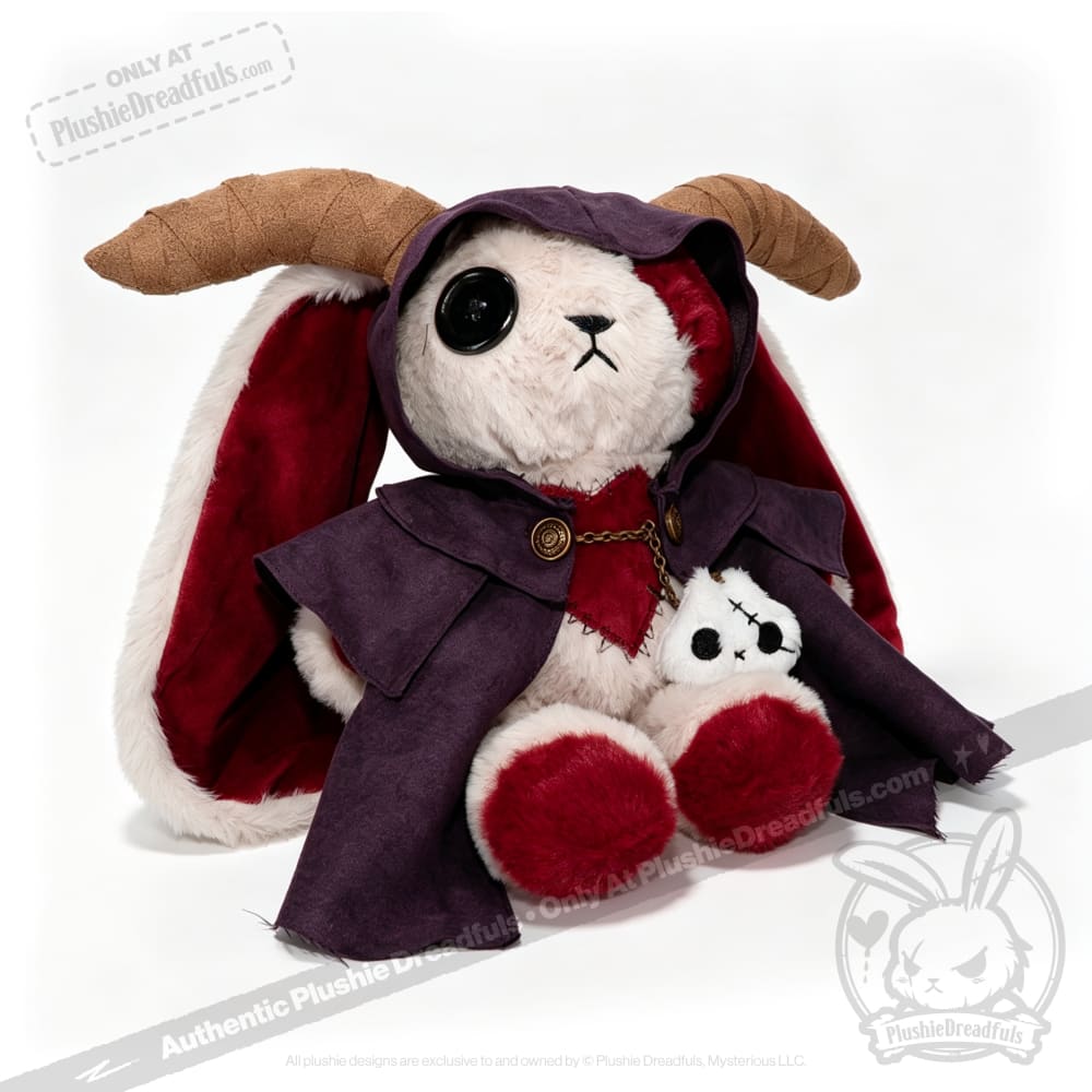 Plushie Dreadfuls horned cloak bunny, one button eye, purple cloak, holding a stitched doll on white background.
