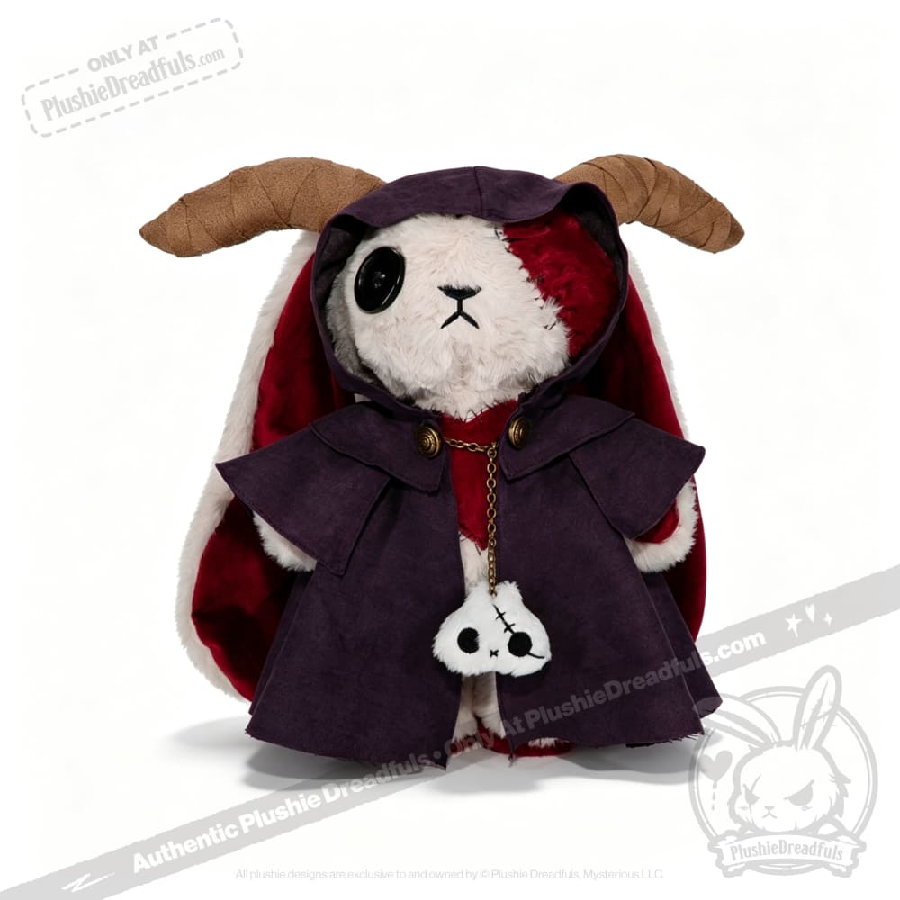 A Plushie Dreadfuls bunny with horns, a purple horned cloak, and a skull accessory on its chest.