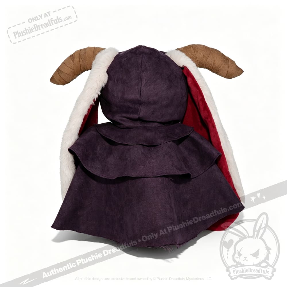 A Plushie Dreadfuls toy in a horned cloak with white fur trim, dark hood, and large brown horns, seen from behind.