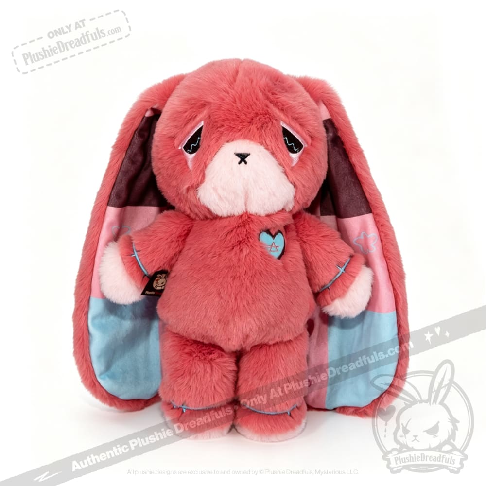 Pink plush bunny with long ears and a heart patch—an adorable awareness rabbit for any chronic illness gift or collection.
