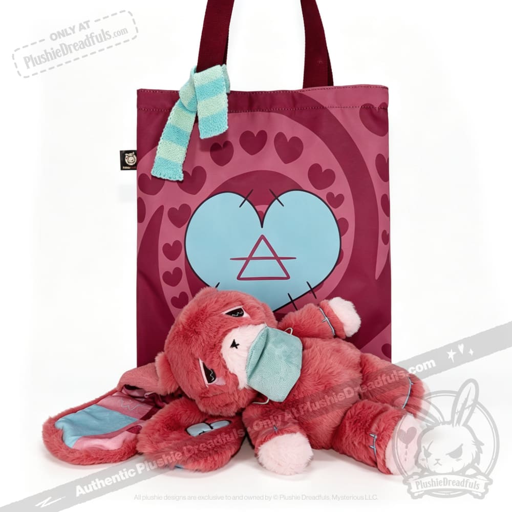 A plush awareness rabbit with a teal mask lies before a maroon heart tote—an ideal chronic illness gift.