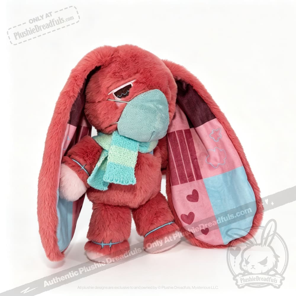 Plush pink awareness rabbit with patchwork ears, blue mask, and striped scarf—thoughtful chronic illness gift.