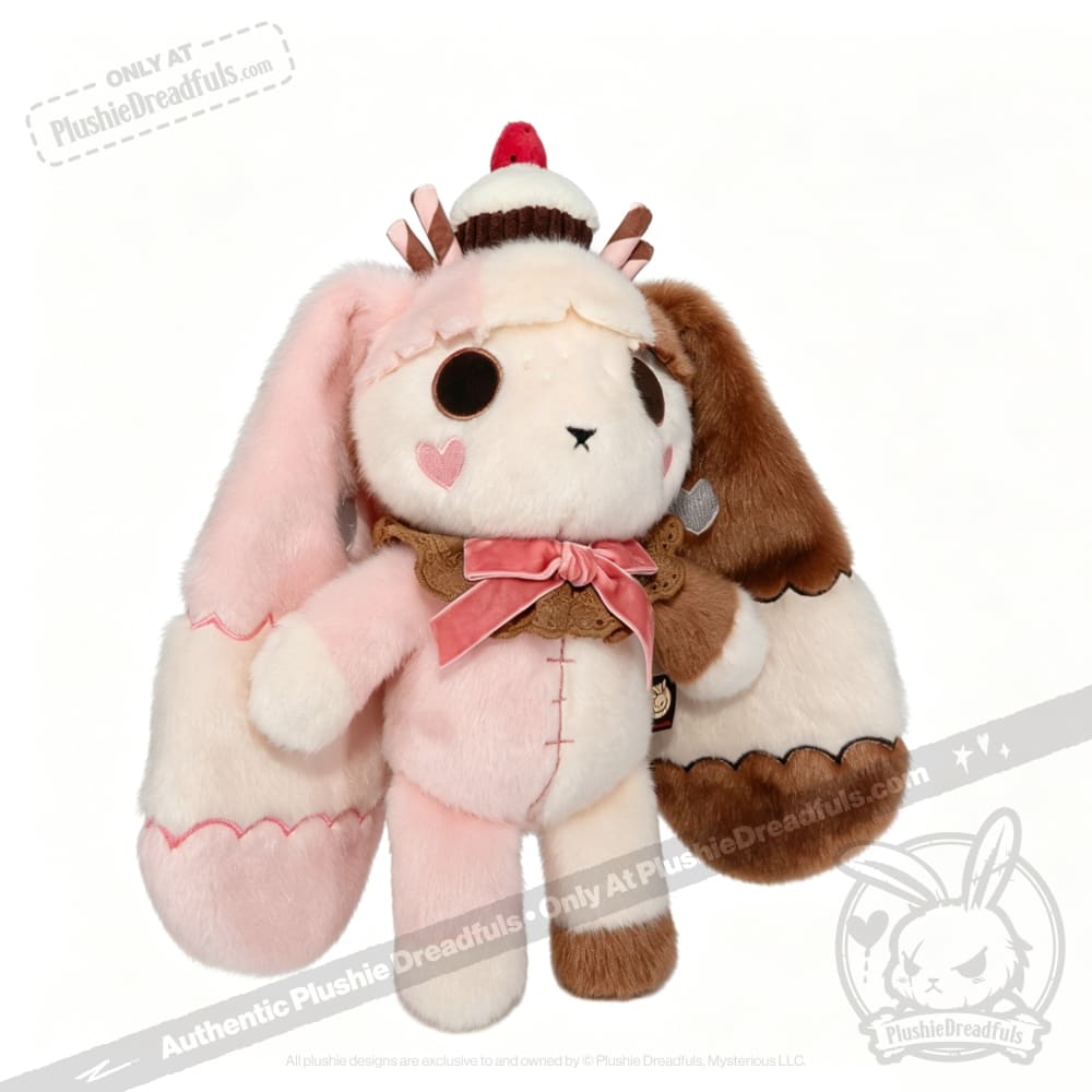 Neapolitan Bunny: This super soft rabbit plushie has a cupcake on its head and a pink bow—Plushie Dreadfuls style!.