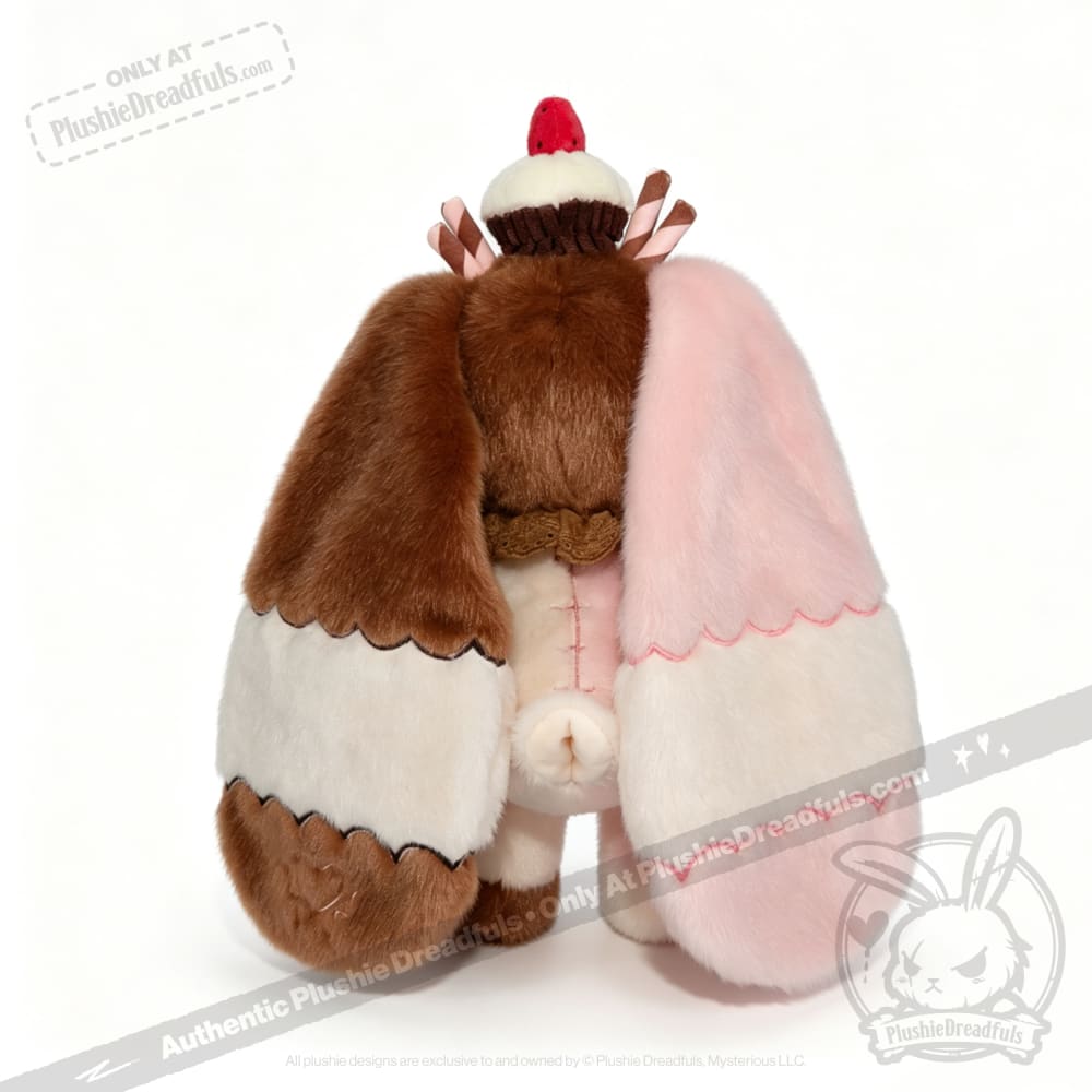 Neapolitan Bunny plush toy with super soft, cake-like ears, cupcake on head, and cute tail in brown, pink, and white.