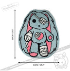 Ouchie Rabbit Rug: A blue and pink bunny rug with bandages, measuring 80cm x 64cm from Plushie Dreadfuls.