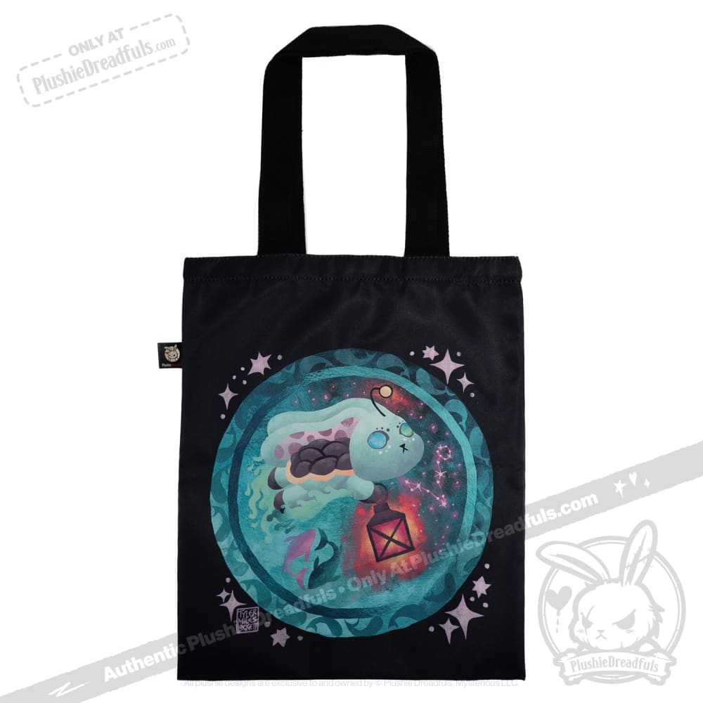 Black tote bag with a cute, glowing turtle amid stars—perfect for fans of zodiac stuffed animal designs.