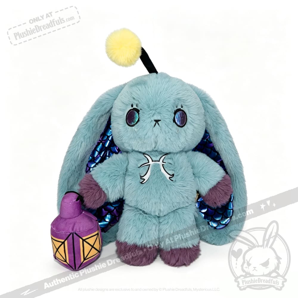 A teal Pisces Rabbit plushie with iridescent wings, purple paws, and a lantern—part of the Plushie Dreadfuls zodiac series.