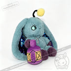 Blue Pisces Rabbit plush with shiny ears holds a purple lantern, a zodiac stuffed animal from Plushie Dreadfuls.