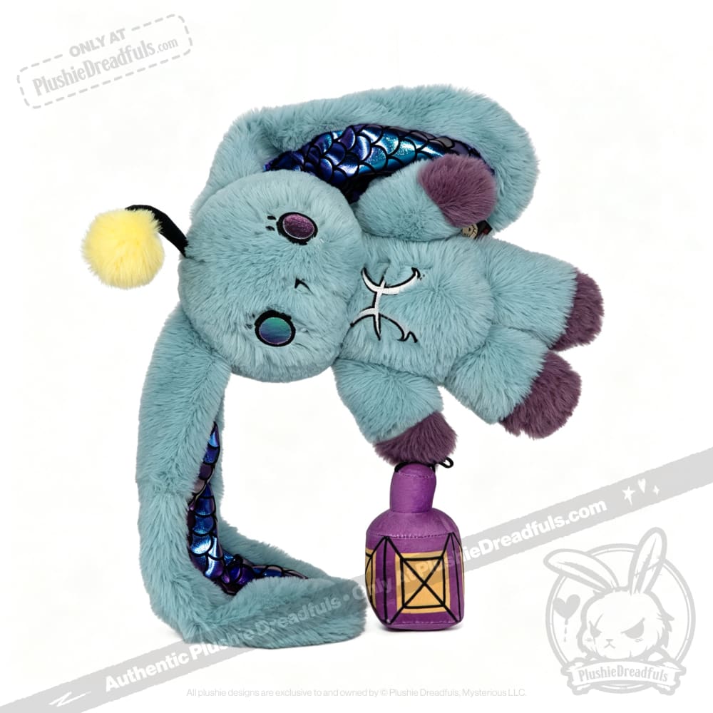 A blue Plushie Dreadfuls creature with a yellow antenna and scaly belly playfully holds a purple lantern.