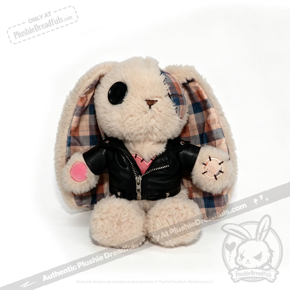 Plush bunny in a plushie jacket with plaid ears and pink patch sits on white—perfect for full-size plushies fans.