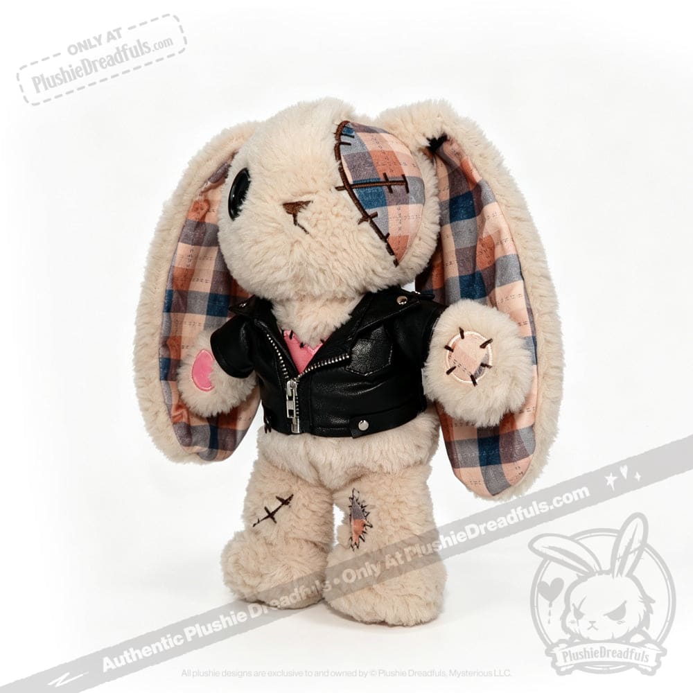 Plush bunny with plaid ears, patchwork details, a faux leather plushie jacket, and a pink heart on its paw.