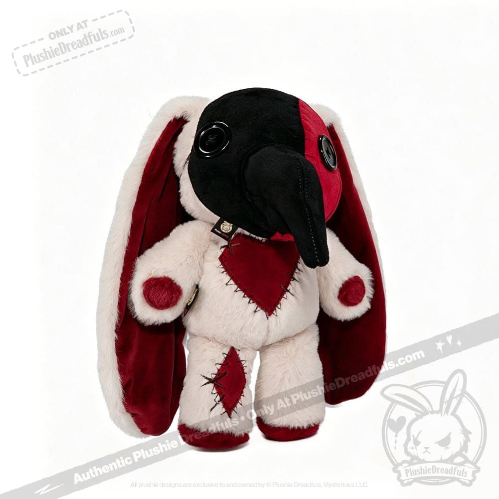 Plushie Dreadfuls toy with long red and white ears, button eyes, black trunk, and red heart patches with black stitching.