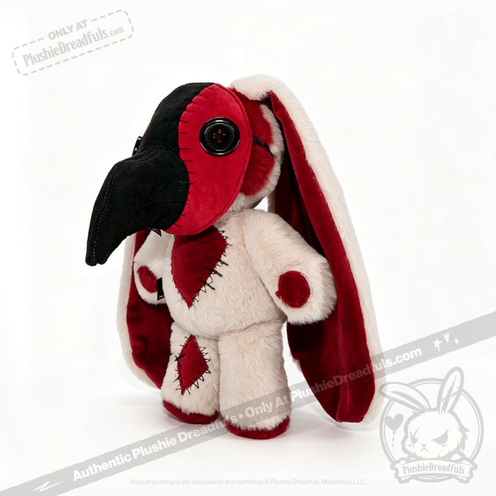 Plushie Dreadfuls plush doll with long red and white ears, black beak like a plague mask, and red heart patch.