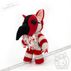 Plushie Dreadfuls toy with red stripes, button eyes, black beak like a comfy plague mask, and bow with red splatters.