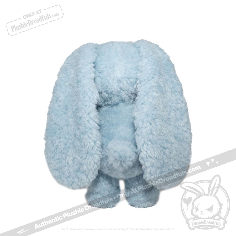 A Plushie Dreadful blue stuffed animal with large floppy ears, standing upright and facing forward.