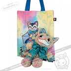 A vibrant tote bag and a plush toy—both inspired by the Victorian McGee's Autism Acceptance Cheshire Cat Plush Stuffed Animal, featuring a cartoon cat with a big bow, cheerful, multicolored smile, and playful design—celebrate autism acceptance with a whimsical Alice in Wonderland flair.