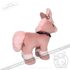 Pink and white plush dog toy from plushiedreadfuls.com, with a black collar, ear piercings—limited edition plushie.