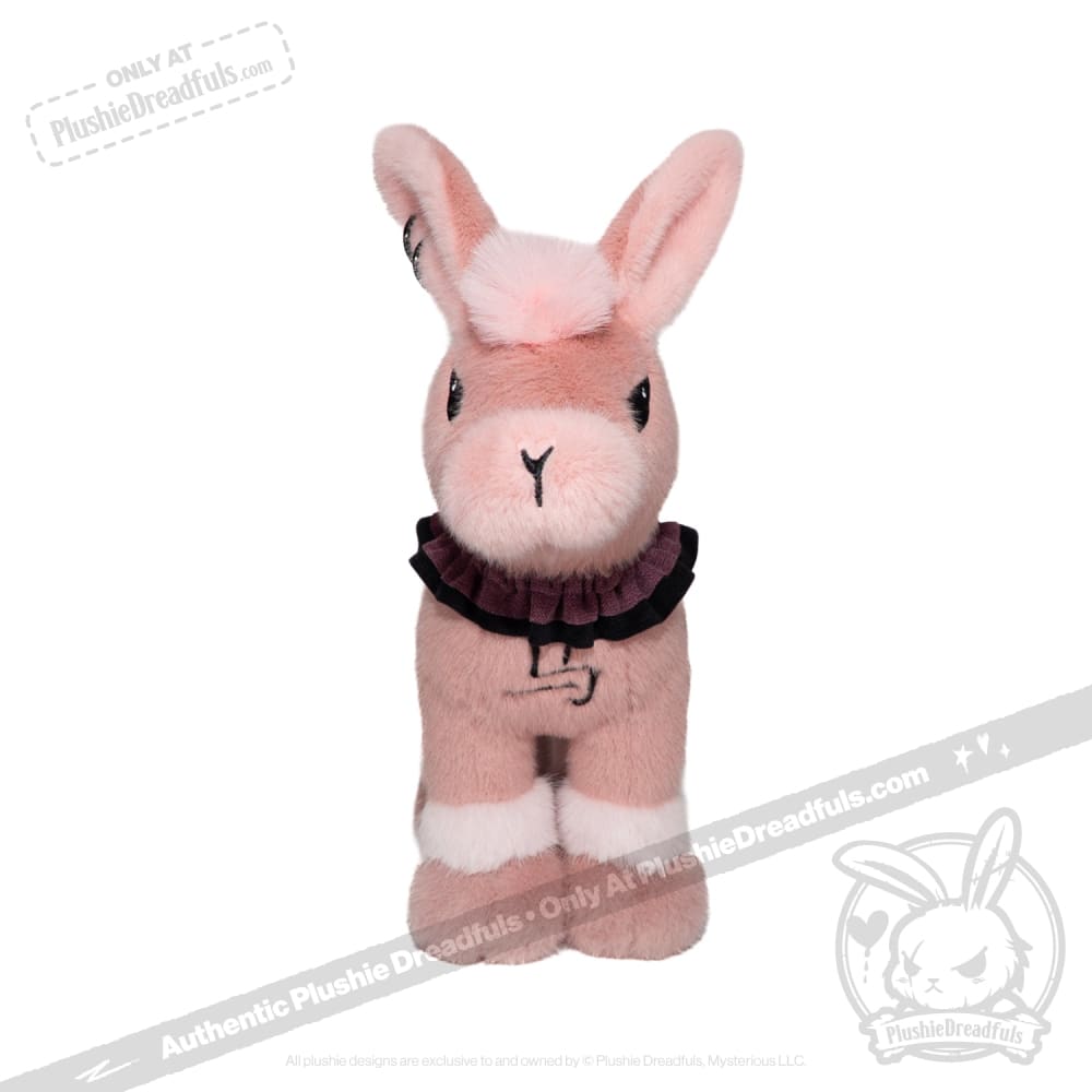 A pink plush bunny from plushiedreadfuls.com with white accents, black collar, and upright stance against a white background.